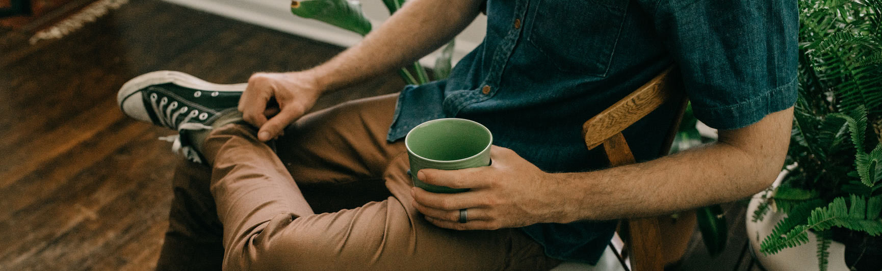 Man holding cup of tea