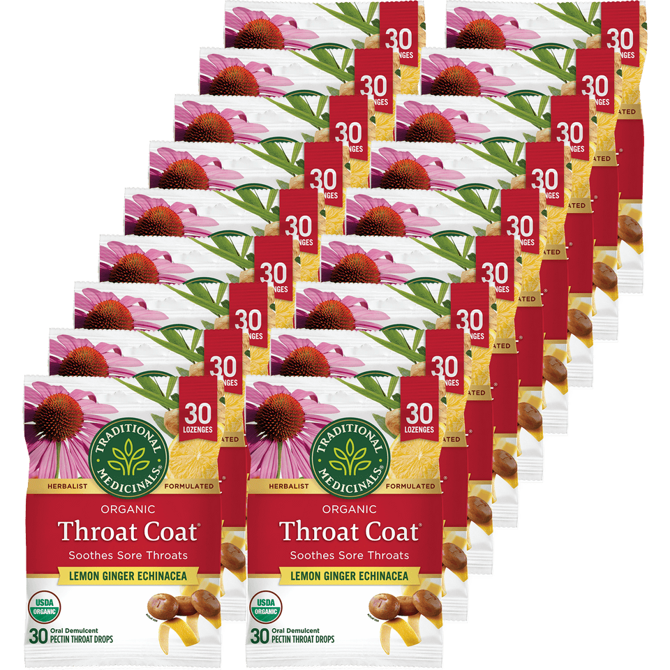 Multiple boxes of Traditional Medicinals Organic Throat Coat throat drops on a white background